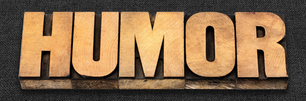 HUMOR spelled out in movable type blocks