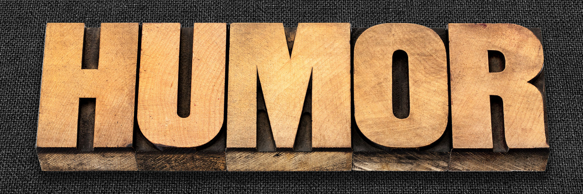 HUMOR spelled out in movable type blocks