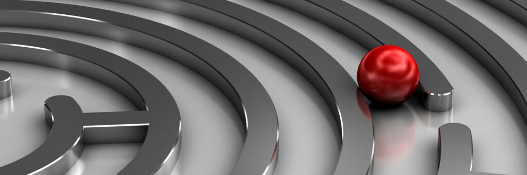 red ball in a silver maze